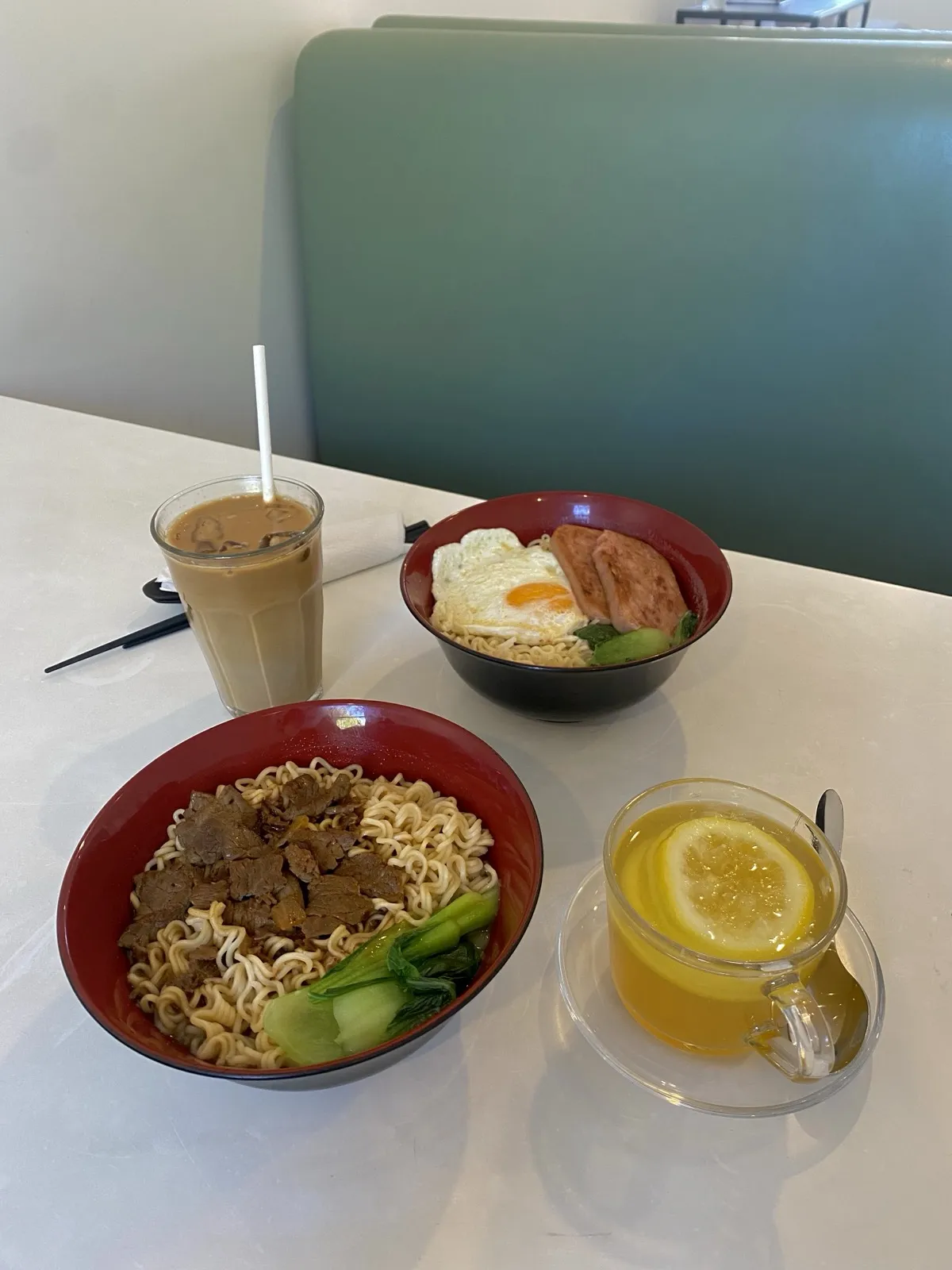 Hong Kong food dishes — noodles, milk tea, and lemon tea at The Peak Hong Kong Cafe